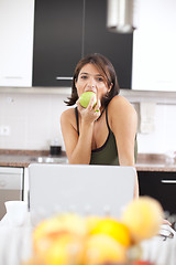 Image showing Modern woman reading e-mails at her breakfast