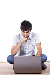 Image showing Happy young man surfing the internet