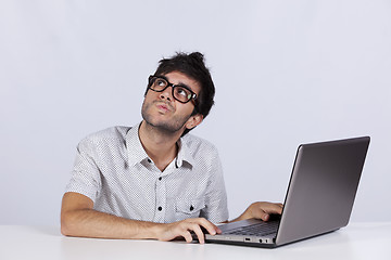 Image showing Young man working with his laptop