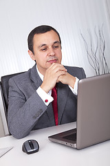 Image showing Mature businessman working