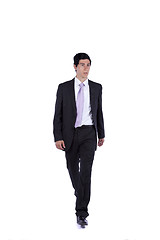 Image showing Businessman walking and looking away