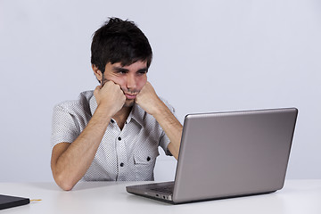 Image showing Young working with his laptop