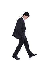 Image showing Businessman walking and looking down