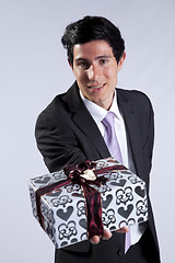 Image showing Businessman with a gift package