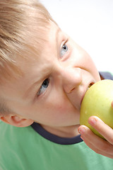 Image showing boy biting an apple