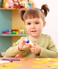 Image showing Little girl doing arts and crafts in preschool