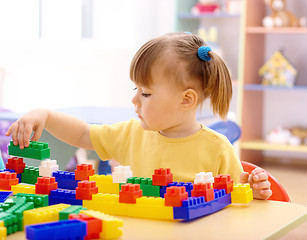 Image showing Little girl play with building bricks in preschool