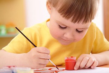 Image showing Child draws with paints in preschool