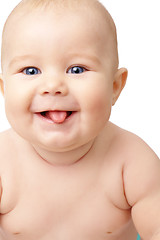Image showing Happy toddler smiling, sticking his tongue out