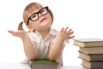 Image showing Cute little girl with book, back to school
