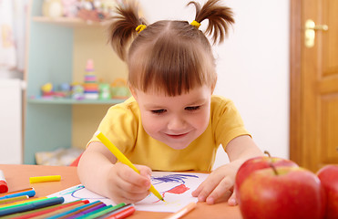 Image showing Little girl draws with felt-tip pen