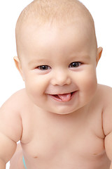 Image showing Happy toddler smiling, sticking his tongue out