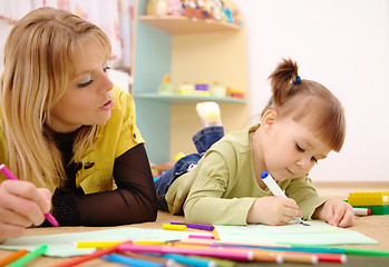 Image showing Teacher with child in preschool