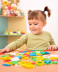 Image showing Little girl play with building bricks in preschool