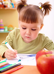 Image showing Little girl draws with felt-tip pen