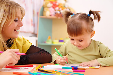 Image showing Teacher with child in preschool