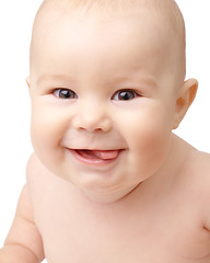 Image showing Happy toddler smiling, sticking his tongue out