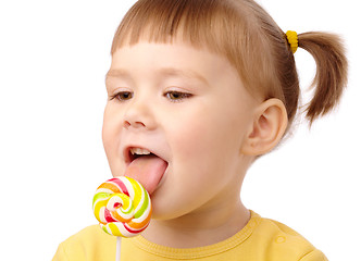 Image showing Little girl with lollipop