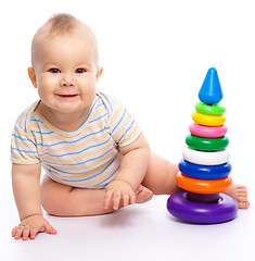 Image showing Little boy play with toys