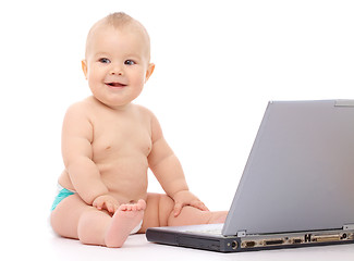 Image showing Little baby with laptop