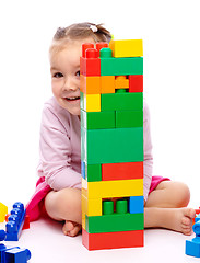 Image showing Little girl with building bricks