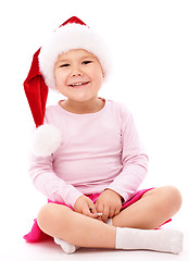 Image showing Little girl wearing red Christmas cap