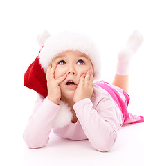 Image showing Little girl wearing red Christmas cap