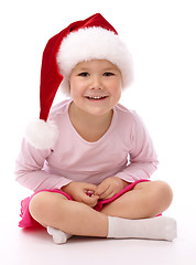 Image showing Little girl wearing red Christmas cap