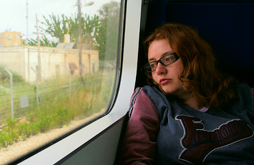 Image showing Girl on train looking outside