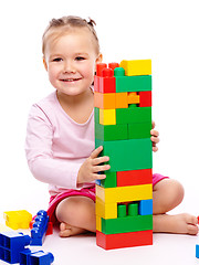 Image showing Little girl with building bricks