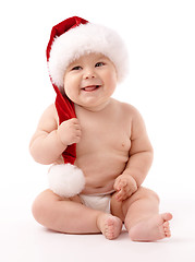 Image showing Little child wearing red Christmas cap