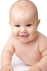 Image showing Happy toddler smiling, sticking his tongue out