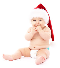 Image showing Little child wearing red Christmas cap