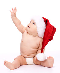 Image showing Little child wearing red Christmas cap