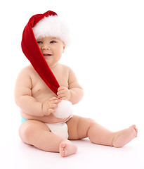 Image showing Little child wearing red Christmas cap