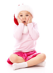 Image showing Little girl wearing red Christmas cap