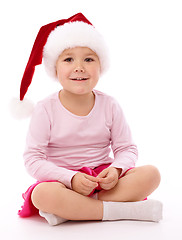 Image showing Little girl wearing red Christmas cap