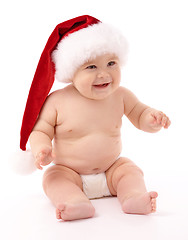 Image showing Little child wearing red Christmas cap