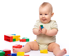 Image showing Little boy with building bricks