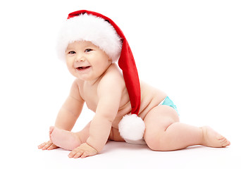 Image showing Little child wearing red Christmas cap