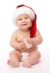 Image showing Little child wearing red Christmas cap