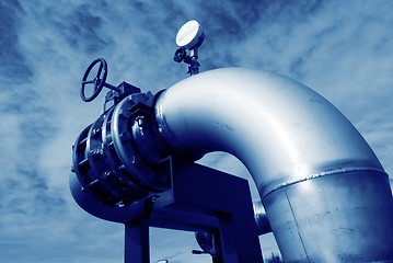 Image showing Industrial zone, Steel pipelines and valves against blue sky