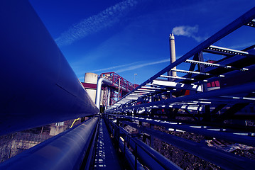 Image showing Industrial zone, Steel pipelines and valves against blue sky