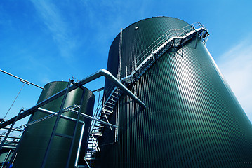 Image showing Industrial zone, Steel pipelines and valves against blue sky