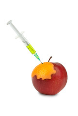 Image showing GMO: apple being mutated into the orange after injection of unknown green liquid