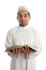 Image showing Smiling man holding a book