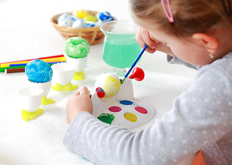 Image showing Painting Easter eggs