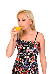 Image showing Female drinks martini.