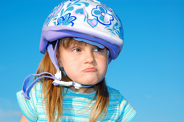 Image showing grimacing girl with a helmet