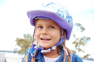 Image showing happy girl wearing a helmet